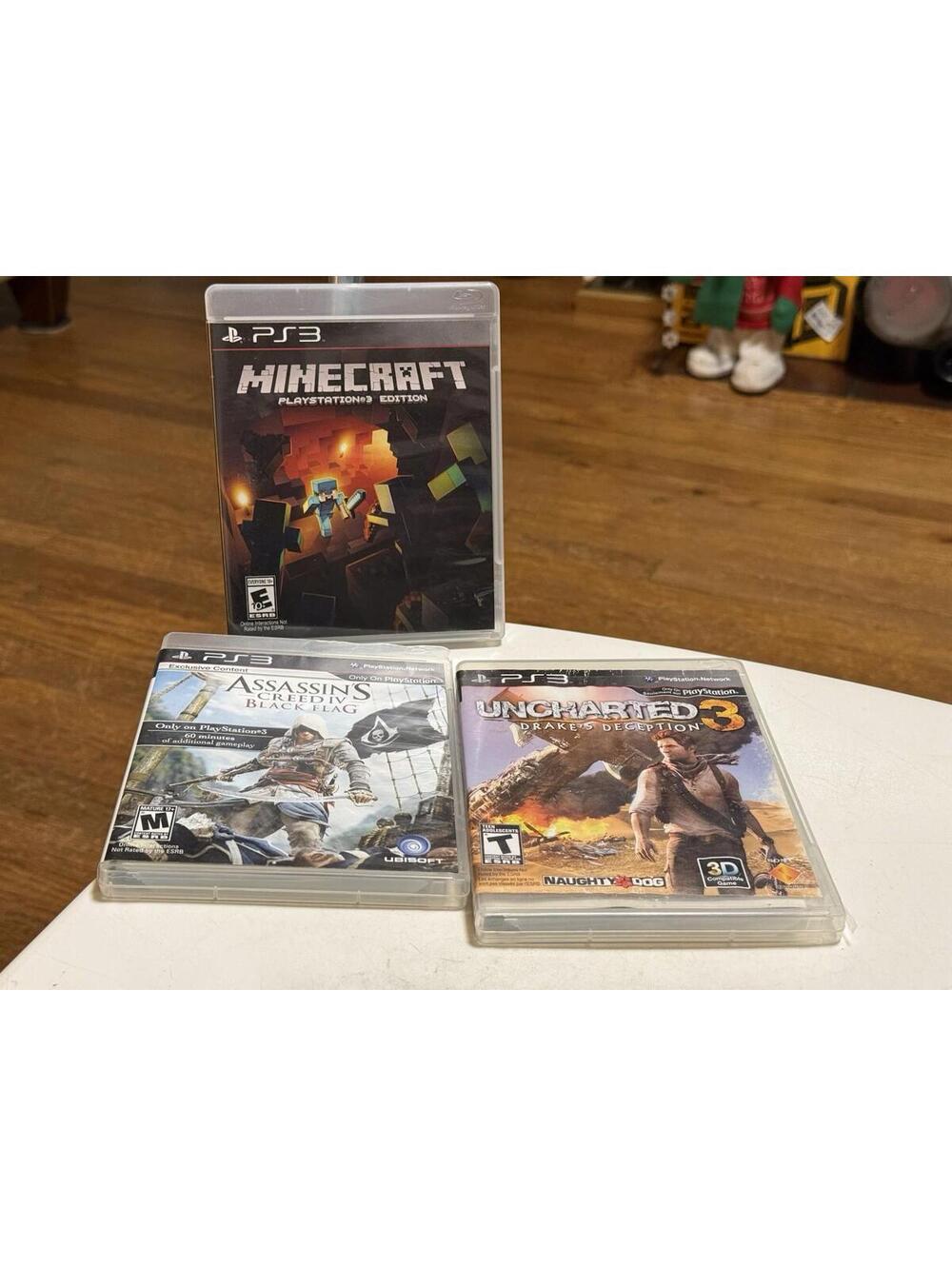 PS3 Games Lot Of 3 , Minecraft, Assassin Creed IV Black Flag , Uncharted 3